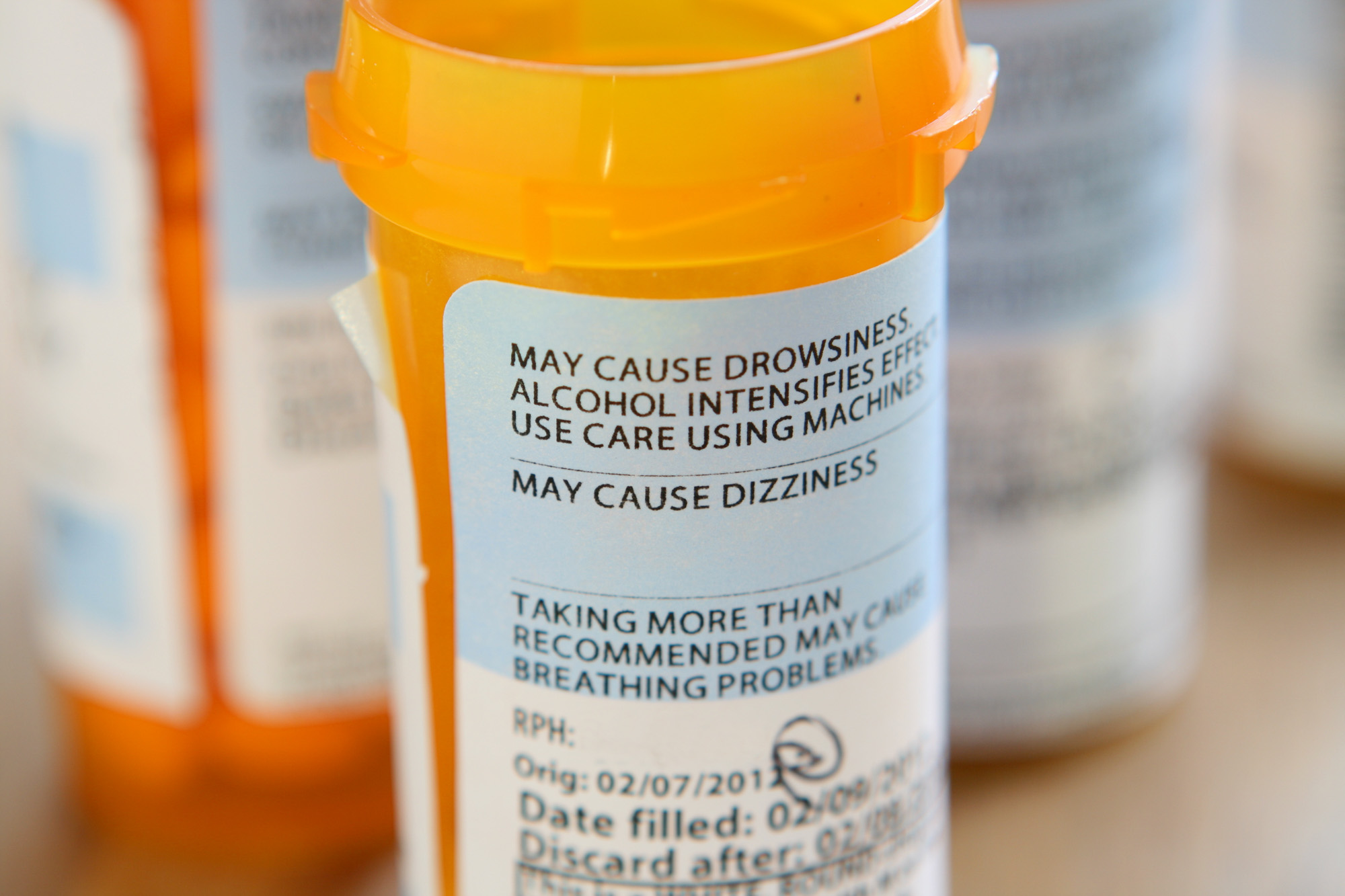 A prescription bottle that carries a warning about not mixing medications with alcohol.