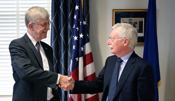 Photo showing N.I.H. Director Francis Collins shakes hands with Dr. George Koob