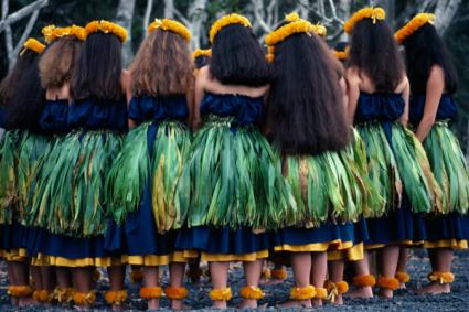 USA Hawaii Halemaumau Volcano Crater Group of hula dancers stand in circle with bowed heads beside the crater