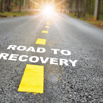 Road with text superimposed, "ROAD TO RECOVERY"