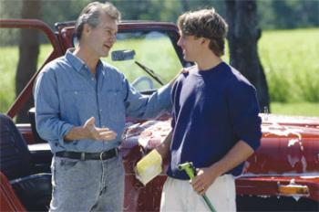 Photo of father speaking to teenage son