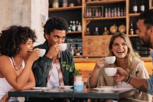 Friends drinking coffee at a coffee shop